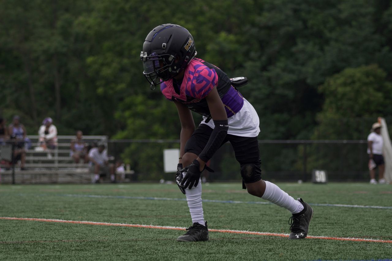 Youth football player in action on the field in Columbia, MD.